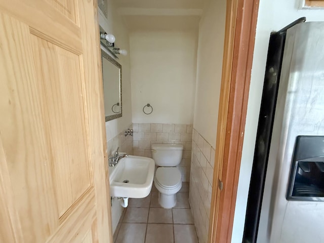 1714 W Beverly Glen Pkwy, Chicago, IL 60643 - half bath featuring tile walls, tile patterned flooring, a sink, a wainscoted wall, and toilet
