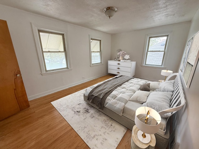 1714 W Beverly Glen Pkwy, Chicago, IL 60643 - bedroom with a textured ceiling, baseboards, and wood finished floors