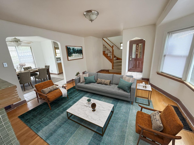 1714 W Beverly Glen Pkwy, Chicago, IL 60643 - living room with a ceiling fan, arched walkways, wood finished floors, baseboards, and stairs