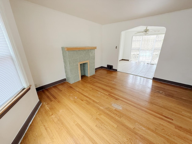 1714 W Beverly Glen Pkwy, Chicago, IL 60643 - unfurnished living room with visible vents, wood finished floors, a fireplace, baseboards, and ceiling fan