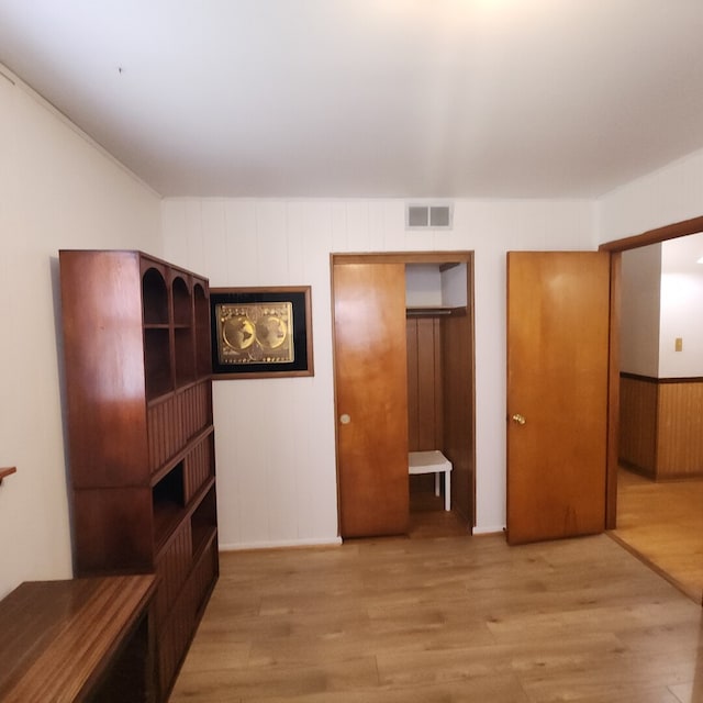 11258 S Normandy Ave, Worth, IL 60482 - unfurnished bedroom featuring visible vents, baseboards, and wood finished floors