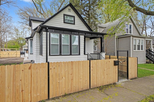 bungalow-style house featuring a gate and fence private yard