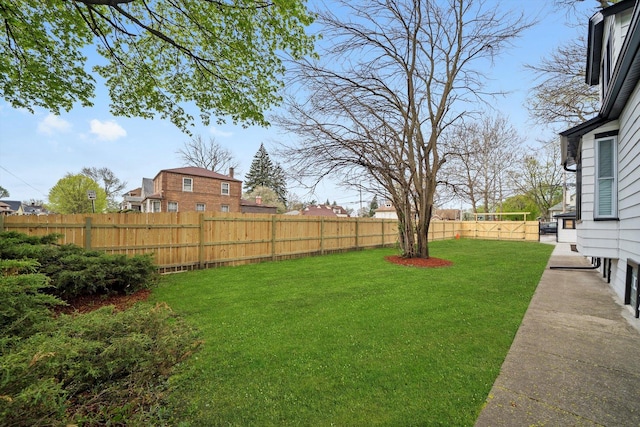view of yard with a fenced backyard