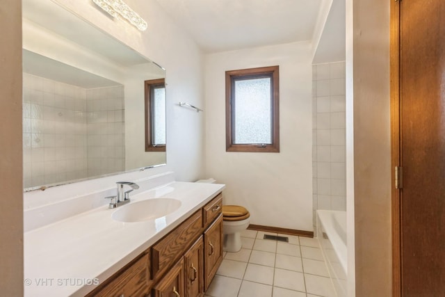 bathroom with tile patterned flooring, vanity, toilet, a tub, and visible vents