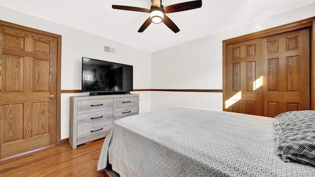 7022 W 64th St, Chicago, IL 60638 - bedroom with visible vents, ceiling fan, and light wood-style floors
