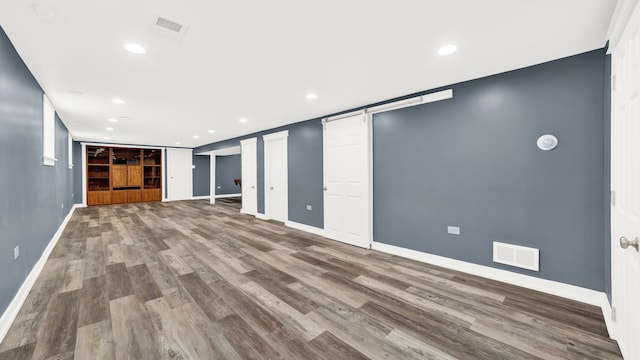 7022 W 64th St, Chicago, IL 60638 - finished below grade area featuring baseboards, visible vents, wood finished floors, and recessed lighting