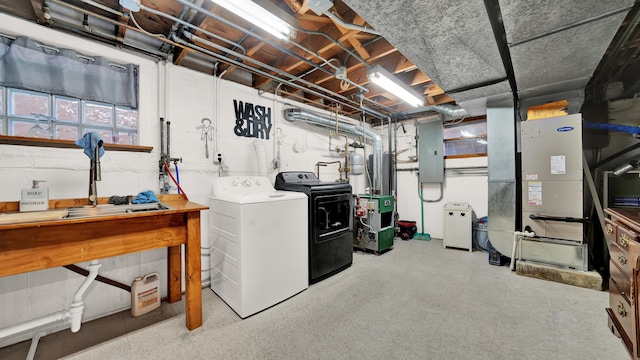 7022 W 64th St, Chicago, IL 60638 - below grade area with washing machine and dryer, electric panel, and a heating unit