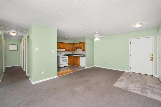 2345 185th Ct Unit 1, Lansing, IL 60438 - unfurnished living room with a ceiling fan, dark carpet, baseboards, and a sink