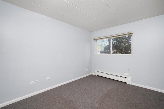 carpeted empty room featuring baseboards and a baseboard radiator