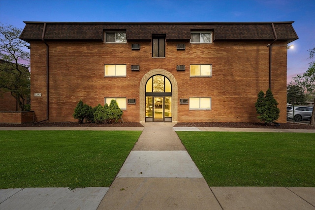 2345 185th Ct Unit 1, Lansing, IL 60438 - view of front of property with brick siding, a lawn, mansard roof, and roof with shingles