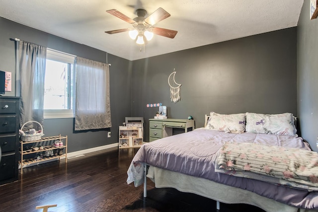 bedroom featuring a ceiling fan, baseboards, and hardwood / wood-style flooring