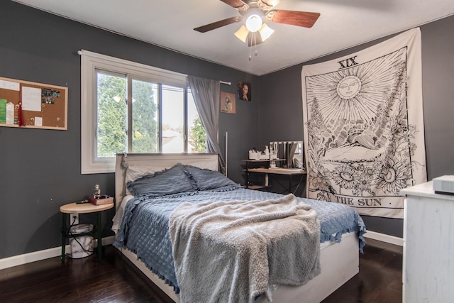 bedroom featuring baseboards, a ceiling fan, and wood finished floors
