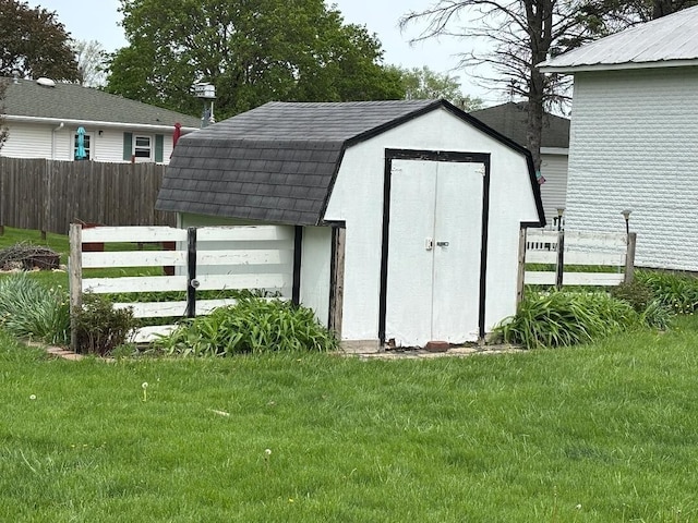 view of shed with fence
