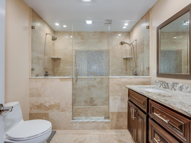 full bathroom with vanity, recessed lighting, a tile shower, and toilet