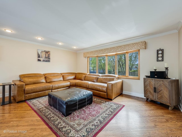 living room with crown molding, recessed lighting, baseboards, and light wood-style floors