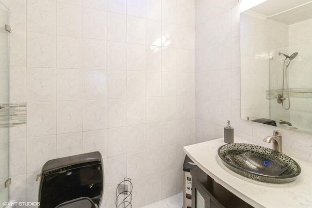 full bath with heating unit, tile walls, vanity, and a shower