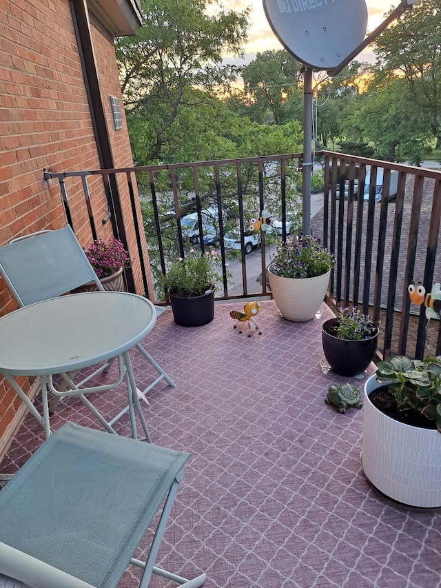 view of balcony at dusk