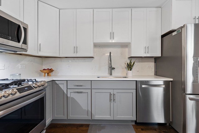 2011 Brentwood Rd, Northbrook, IL 60062 - kitchen featuring appliances with stainless steel finishes, a sink, light countertops, and tasteful backsplash