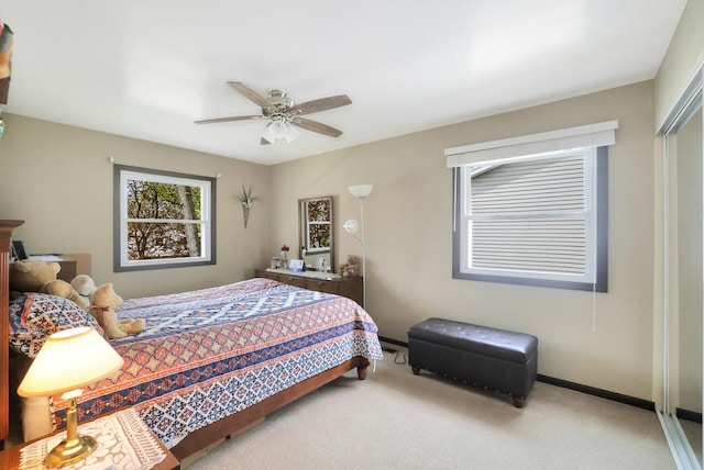 bedroom with carpet floors, baseboards, a closet, and ceiling fan