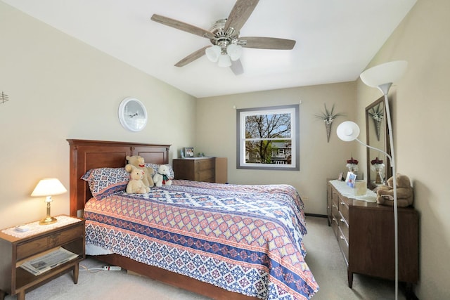 bedroom featuring ceiling fan and light colored carpet