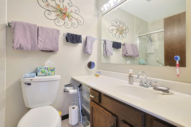 full bathroom featuring vanity, toilet, and a stall shower