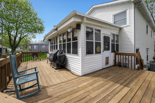 deck with central AC and grilling area
