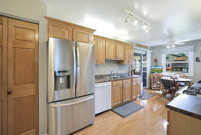 kitchen featuring stainless steel refrigerator with ice dispenser, dark countertops, ceiling fan, and dishwasher