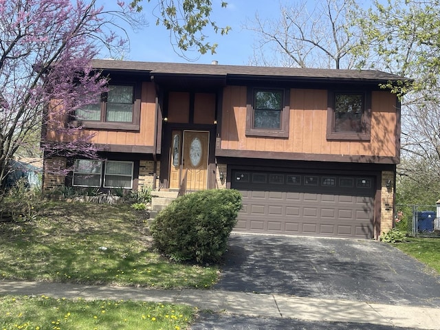 122 Deerpath Rd, Matteson, IL 60443 - split foyer home with aphalt driveway, brick siding, and a garage