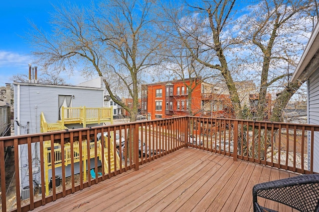 wooden terrace featuring a residential view