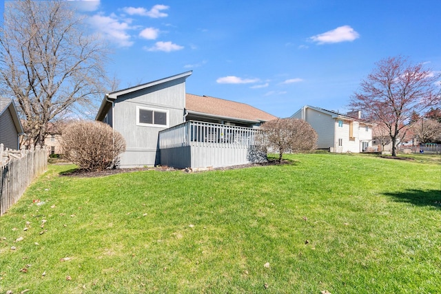 2245 Lakeside Dr, Aurora, IL 60504 - rear view of house with fence and a lawn