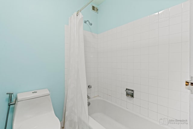 full bath with toilet, visible vents, and shower / bathtub combination with curtain