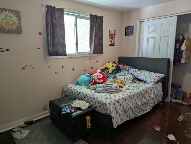 bedroom with wood finished floors