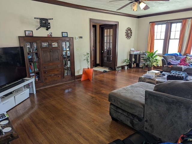 living room featuring ornamental molding, a ceiling fan, and wood finished floors