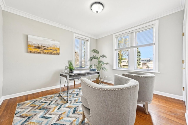 office space with ornamental molding, wood finished floors, and baseboards