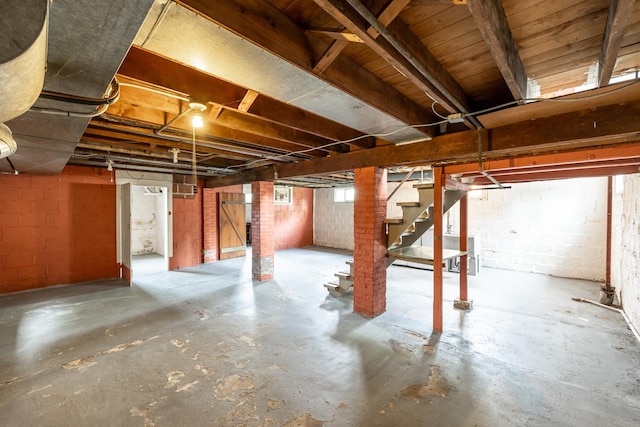 below grade area with concrete block wall and stairs