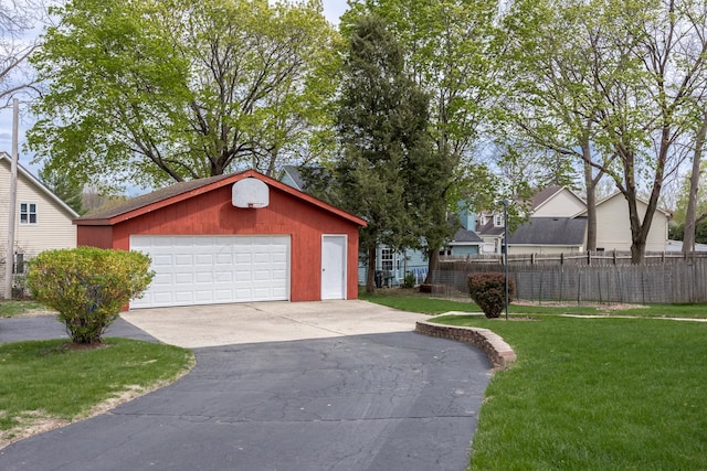 detached garage featuring fence