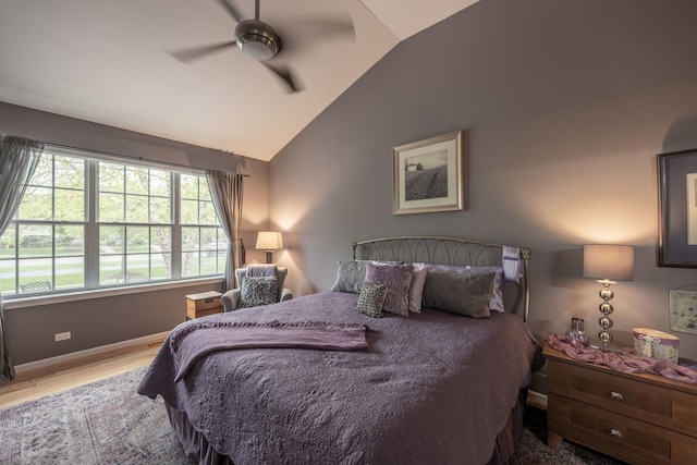 825 Canton Dr, Oswego, IL 60543 - bedroom with baseboards, ceiling fan, vaulted ceiling, and wood finished floors