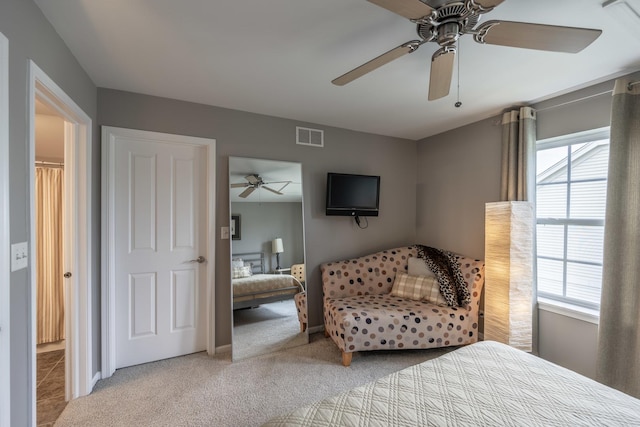 825 Canton Dr, Oswego, IL 60543 - carpeted bedroom featuring ceiling fan, visible vents, multiple windows, and baseboards