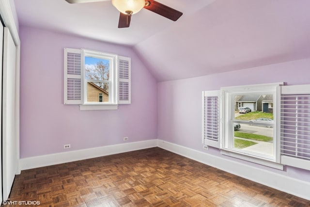 bonus room with baseboards, a ceiling fan, and lofted ceiling