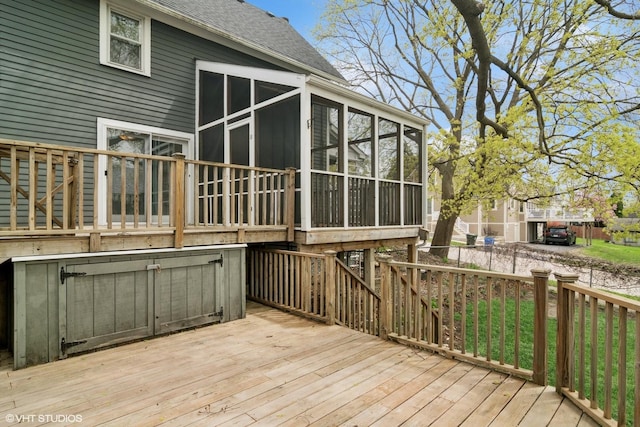 wooden terrace featuring a sunroom