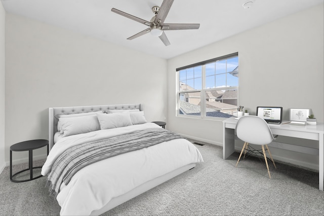 carpeted bedroom with baseboards, a ceiling fan, and visible vents