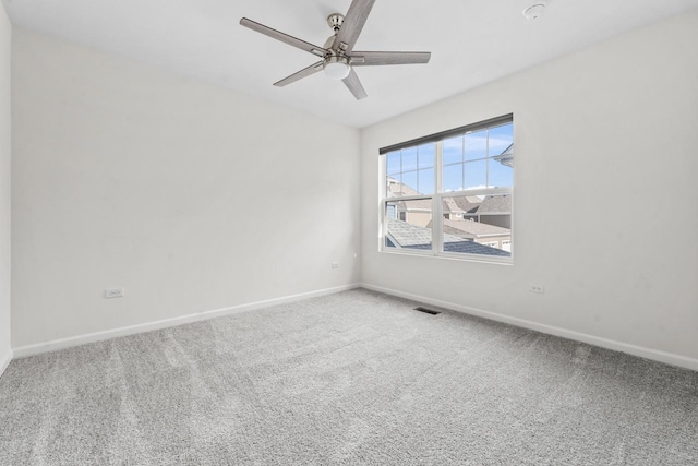 unfurnished room featuring a ceiling fan, baseboards, visible vents, and carpet