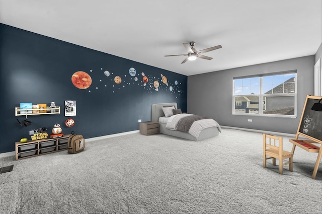 carpeted bedroom with baseboards and a ceiling fan