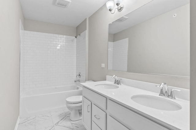 full bath featuring toilet, visible vents, a sink, and marble finish floor