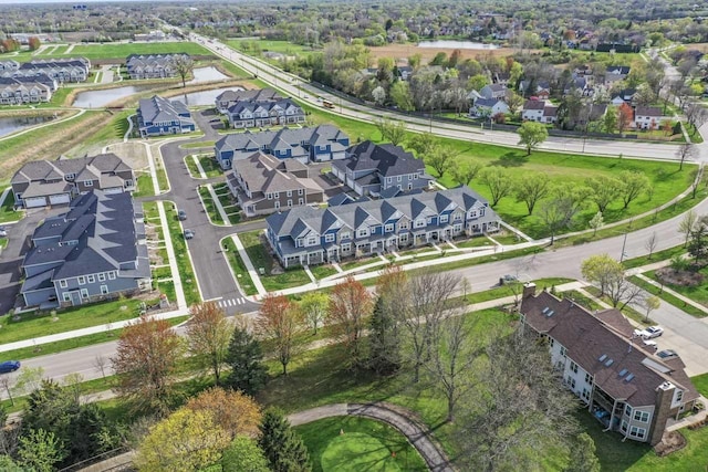 bird's eye view with a water view and a residential view