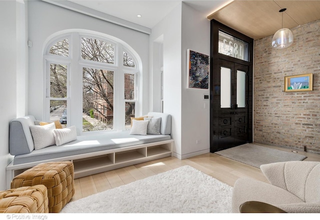 1833 W Evergreen Ave, Chicago, IL 60622 - foyer featuring a towering ceiling, wood finished floors, a healthy amount of sunlight, and brick wall