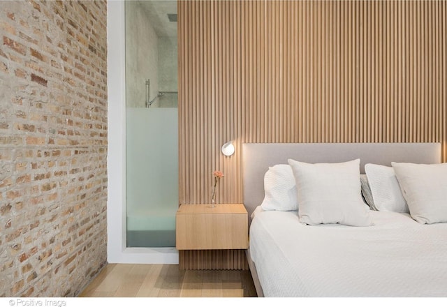 1833 W Evergreen Ave, Chicago, IL 60622 - bedroom featuring brick wall