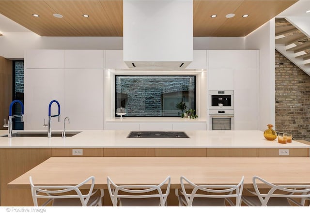 1833 W Evergreen Ave, Chicago, IL 60622 - kitchen featuring wood ceiling, cooktop, a sink, and modern cabinets