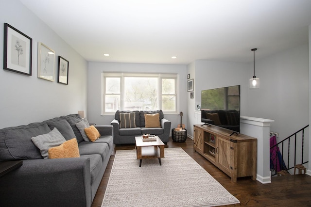 living room featuring baseboards, dark wood-style floors, and recessed lighting