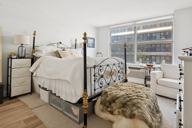 bedroom with wood finished floors